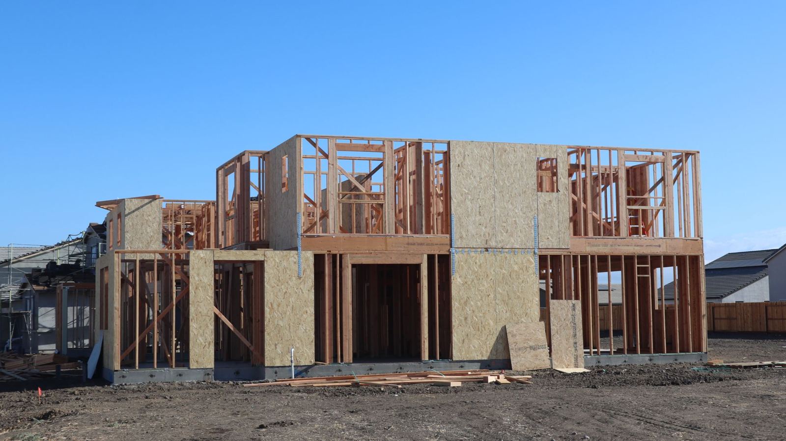 New home under construction with wood framing